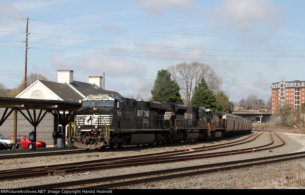 NS 7681 leads grain train 56Z past the station